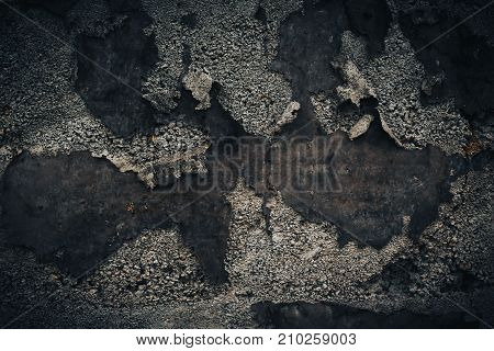 Black wall background. Grunge texture with stone and old iron parts