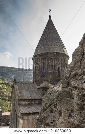 The ancient Christian temple Geghard in the mountains of Armenia