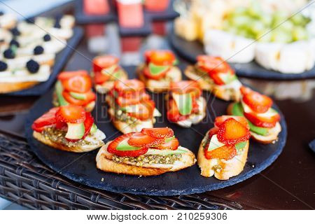 Catering Banquet Table With Different Food Snacks And Appetizers