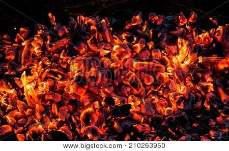 background of burning coals . Photo of an abstract texture