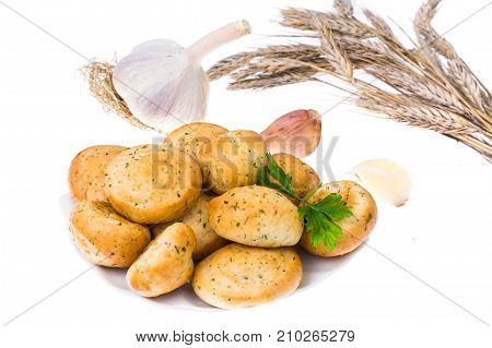 Small snack buns with garlic on plate. Studio Photo