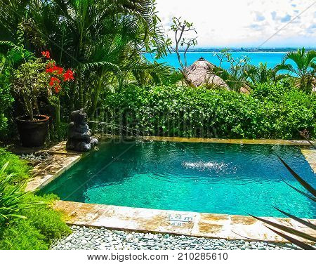 Jimbaran, Bali, Indonesia - April 14, 2014: View of the pool at Four Seasons Resort Bali at Jimbaran Bay