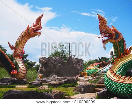 BANGKOK THAILAND - OCTOBER 08 2017: King of Naga statues group over blue sky background at Buddha Uttayarn Luang Phu Sod in Ban Na Dam Prachin Buri province Thailand.
