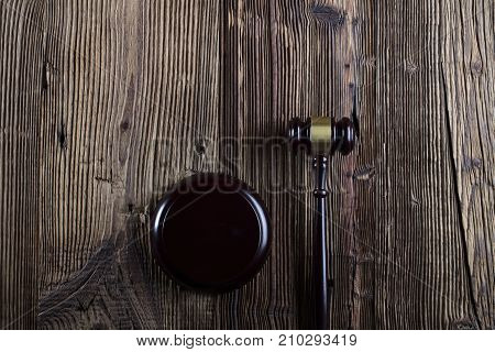 Gavel. Auction and business concept.  Gavel on the wooden background.