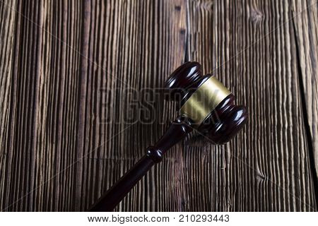Gavel. Auction and business concept.  Gavel on the wooden background.