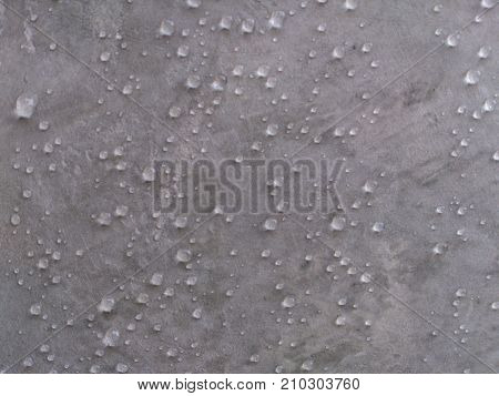 The wall is polished and beautiful in front of the wall in the background.