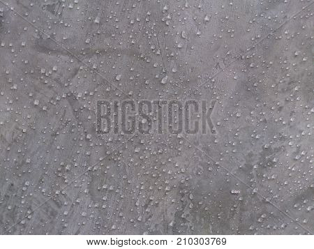 The wall is polished and beautiful in front of the wall in the background.