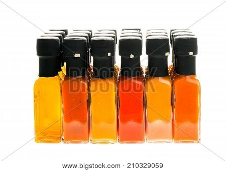 Set Of Hot Chili Sauce Glass Bottles On White Background.