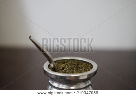 Drinking yerba mate in silver matero with bombilla