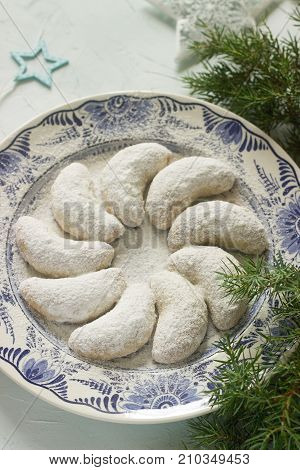 Vanilkipferl - vanilla crescents traditional Christmas cookies in Germany Austria Czech Republic. Homemade cookies in Christmas or New Year's decor. Selective focus.