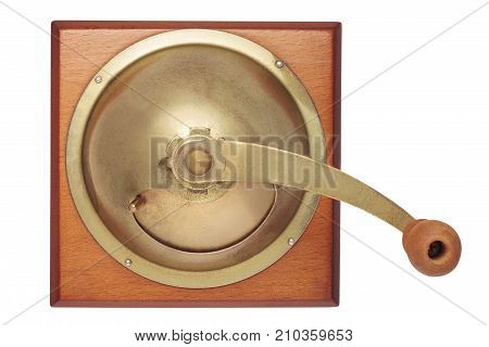 Old manual wooden coffee grinder isolated on white background. Flat lay. Top view