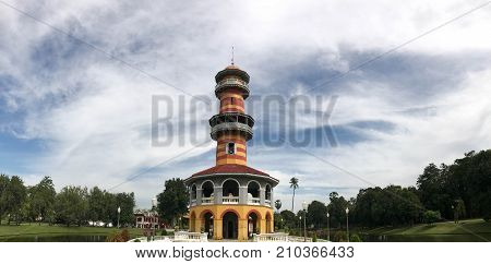 Colorful observatory tower called Ho Withun Thasana with hazy sky at Bang Pa In palace Ayutthaya Thailand
