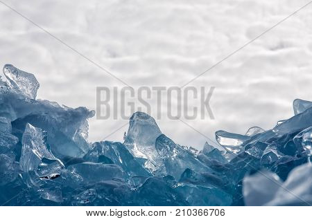 Endless blue ice hummocks in winter on the frozen Lake Baikal. Russia