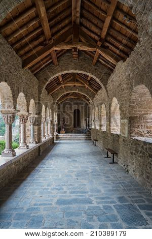 Vertical view of the arched corridor of the Romanesque Abbey of Saint Martin du Canigou