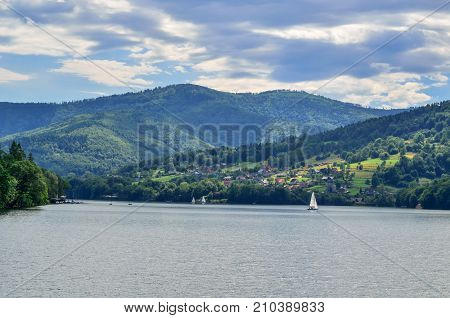 Summer mountain landscape. Beautiful river and green hills.