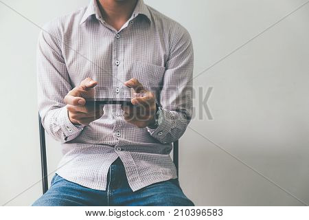 Business process photo. Account manager using mobile phone. Typing contemporary smartphone screen.