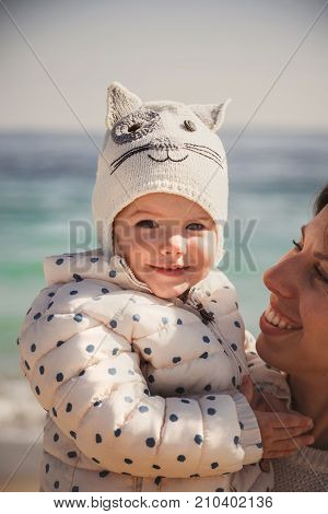 Close Up Of Happy Loving Family, Mother And Small Daughter Together Near The Ocean, Mother Is Holgin