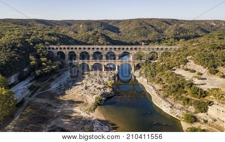 Aerial view of Pont du Gard, an ancient Roman aqueduct that crosses the Gardon River near the town of Vers-Pont-du-Gard in southern France