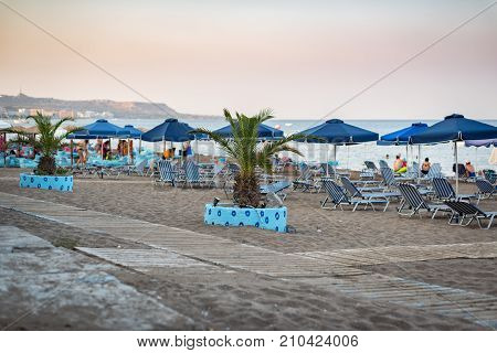 Palm tree as beach decoration on Rhodes island, Greece