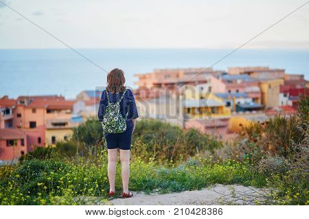 Girl Enjoying View To Castelsardo Village In Sardinia, Italy