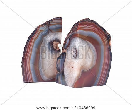 Pair of polished multicolor agate geode bookends isolated on white background