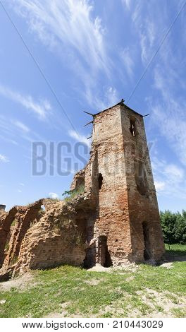 Ruins Of An Ancient Castle Made Of Red Brick. Close-up Photo In Summer. Part Of The Tower Of Golshan