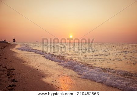 Tropical background sunset view at Puka beach, Boracay island.  Philippines,