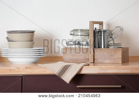 Different kitchenware on table
