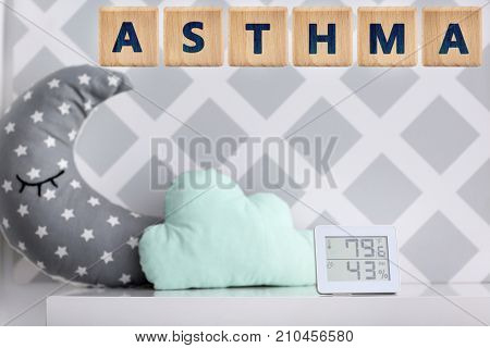 Digital device for temperature and humidity control in baby room. Asthma concept