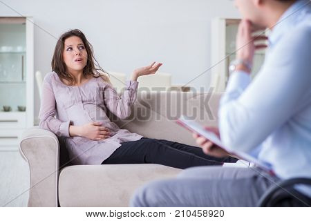 Pregnant woman visiting psychologist doctor