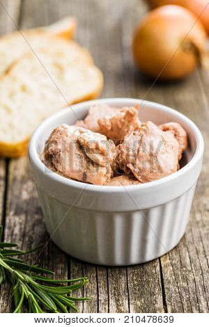 Cod liver in oil in bowl.