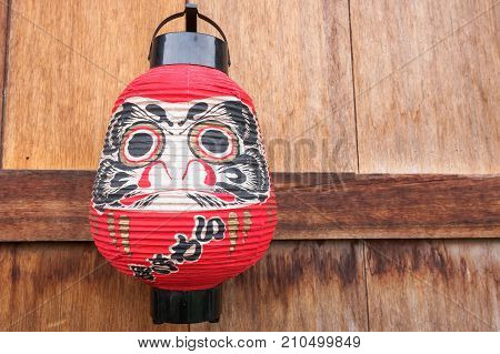 Japanese Lantern on wood background . .