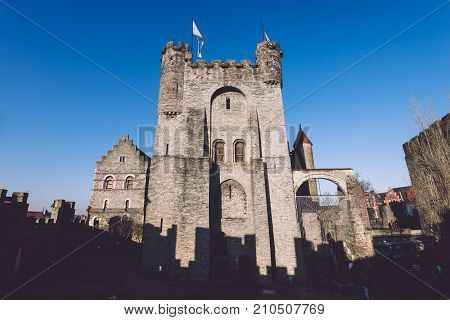 Ghent, Flanders, Belgium - December 30th, 2016. Gravensteen - historical medieval castle in flemish capital Gent. Castle of Counts stronghold by golde hour.