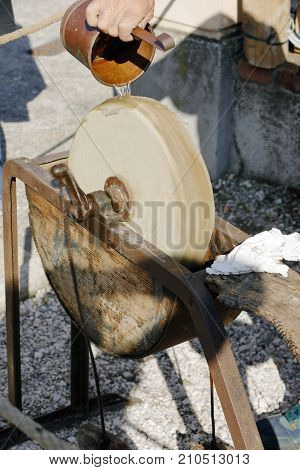 a old stone grinding wheel of a blacksmith