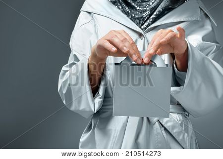 Girl With Small Paper Bag