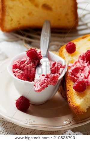 whipped raspberry honey butter in glass jar.selective focus