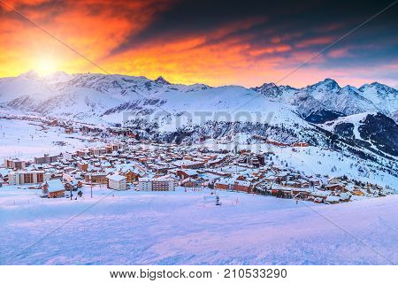 Spectacular winter sunrise landscape and ski resort in French Alps, Alpe d Huez, France, Europe