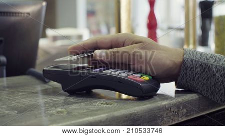 Close up of contactless payment with NFC chip module. PayPass