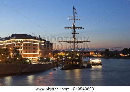 St. Petersburg, Russia - June 18, 2017: View of the Flying Dutchman sailboat on Mytninskaya Embankment in a summer night in St. Petersburg