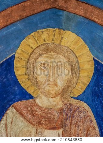 Ancient mural of Jesus Christ a romanesque wall-painting in Bjaresjo church Sweden November 6 2009