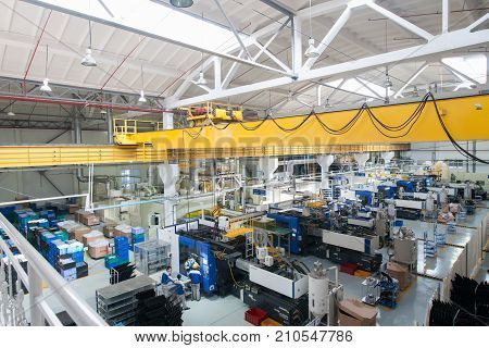 Tashkent Uzbekistan - March 4 2015: Plant for the production and assembly of car headlights. Panorama and overview of the workshop top view. Workers making automotive parts