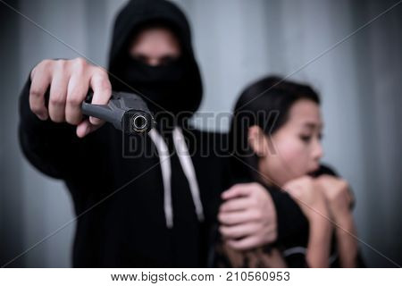 Criminal Man In Hoodie Point Gun With Victim
