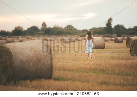 Girl Running In The Field