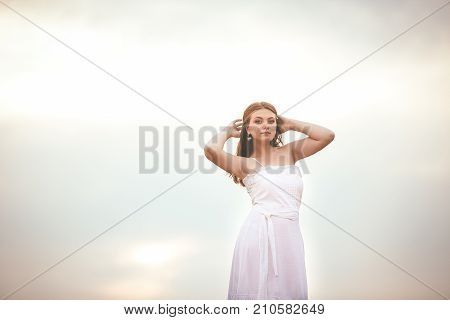 Beautiful Girl On Hay Bales In The Fields