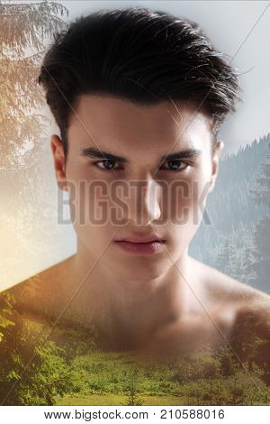 Unpleasant. Unemotional young man with a fashionable hairstyle looking straight in front of himself