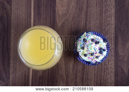 Tasty cupcakes on a white wooden table