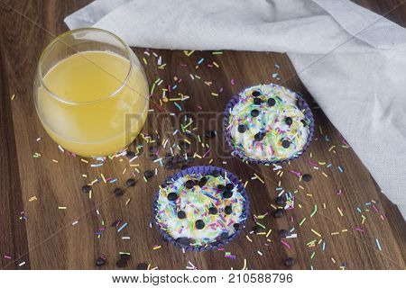Tasty cupcakes on a white wooden table