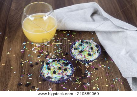 Tasty cupcakes on a white wooden table