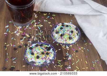 Tasty cupcakes on a white wooden table