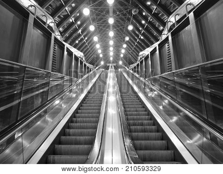Glass lifts up the escalator to switch lights illuminated